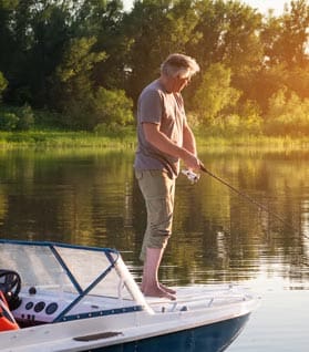 Man Fishing from Boat