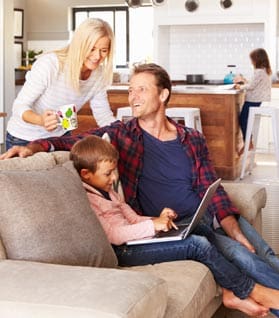 Family Sitting in Home